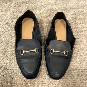 Black “Pure Navy” women’s loafers. Size 6.